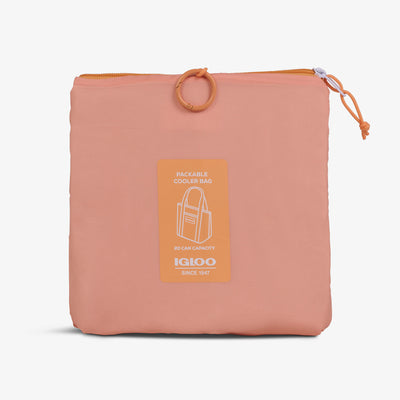 Packed View | Packable Puffer 20-Can Cooler Bag::Apricot::Packs into front zip pocket