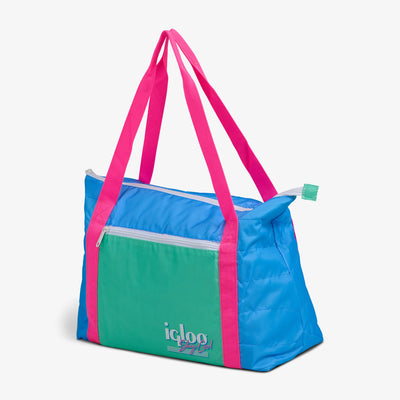 Angle View | Retro Packable Puffer 20-Can Cooler Bag::Carolina Blue::Compressible design 