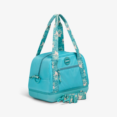 Angle View | Tag Along Too 12-Can Satchel Cooler::Lagoon Teal::Adjustable strap