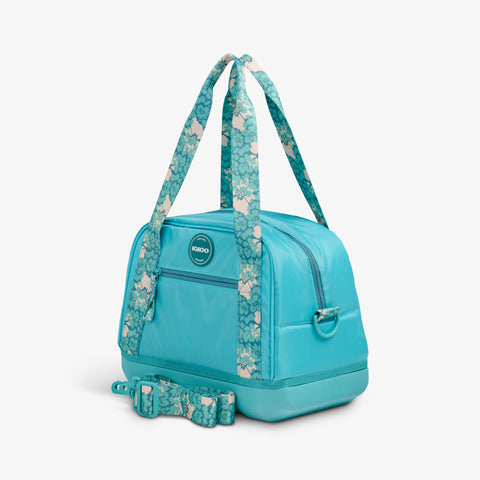 Angle View | Tag Along Too 12-Can Satchel Cooler::Lagoon Teal::Storage pocket