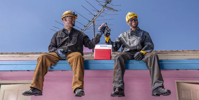 Banner Image | Igloo Playmate | Two men sitting on a roof top
