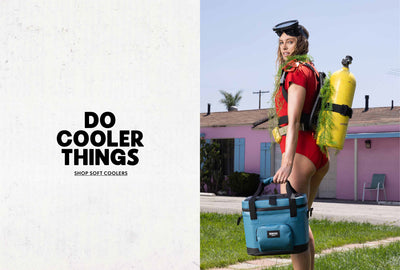 Block Image | Shop Soft Coolers | Image of a woman in scuba gear holding an Igloo Soft Cooler